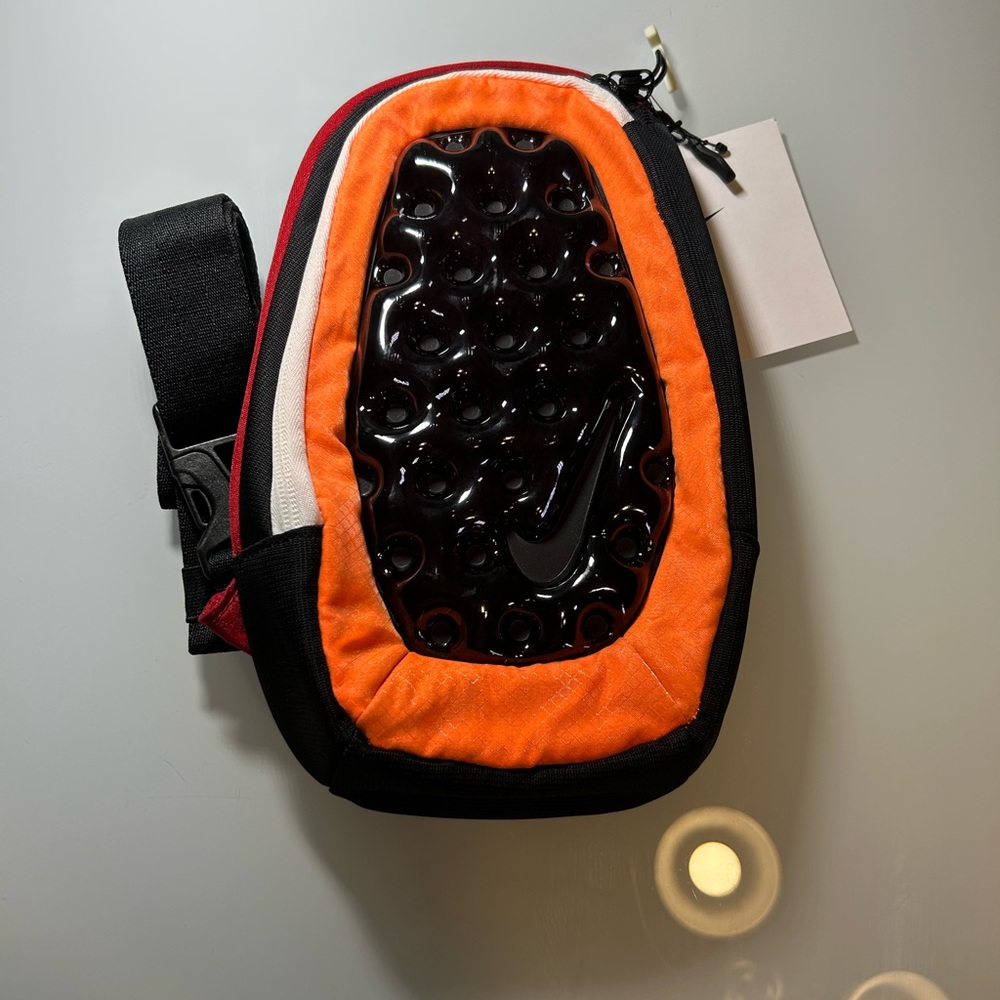 Nike Orange and Black Sling Pouch with Glossy Logo Panel